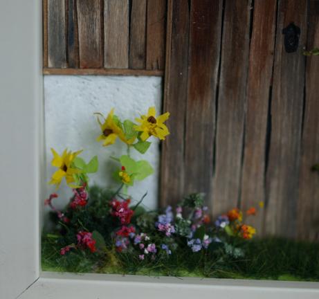 Ausschnitt Blumen vor dem Haus